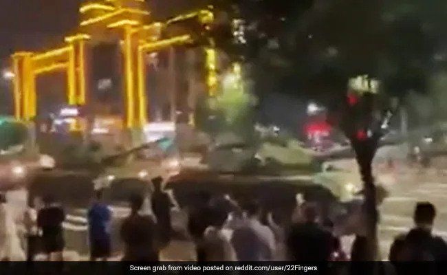 A row of tanks is seen deployed outside the branch of a local bank in a Chinese city. (Screengrab from video posted on reddit.com/user/22Fingers via NDTV)