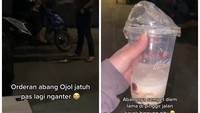 Menumpahkan pesanan minuman pelanggan, ojol ini sempat panik. Beruntung ada sepasang suami istri yang membantu ojol itu untuk memesankan makanan yang sama dengan yang tumpah. Foto: Instagram dramaojol.id
