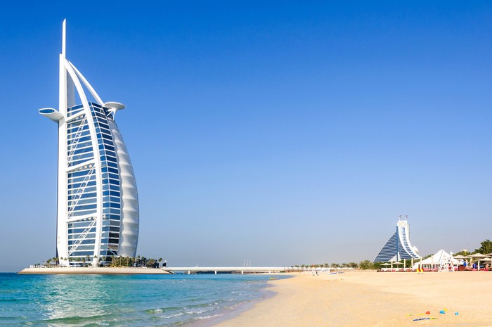 Dubai, United Arab Emirates - January 08, 2012: View of Burj Al Arab hotel from the Jumeirah beach. Burj Al Arab is one of the Dubai landmark, and one of the worlds most luxurious hotels with 7 stars.