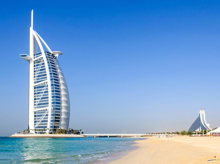 Dubai, United Arab Emirates - January 08, 2012: View of Burj Al Arab hotel from the Jumeirah beach. Burj Al Arab is one of the Dubai landmark, and one of the worlds most luxurious hotels with 7 stars.