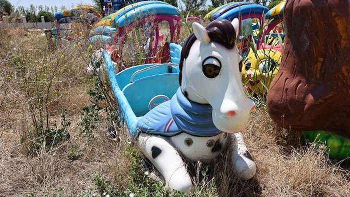 This picture shows abandoned toys and material in the Wonderland Eurasia theme park near the Turkish capital, Ankara, on July 21, 2022, during a press visit to mark its transfer to Ankara Metropolitan Municipality. - The park, opened in March 2019 with the ambition of being 'Europe's largest theme park', was quickly closed less than a year after. Attractions and toys were left to rot since then. (Photo by Adem ALTAN / AFP) (Photo by ADEM ALTAN/AFP via Getty Images)