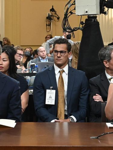 Former National Security Council member Matthew Pottinger (L) and former Deputy White House Press Secretary Sarah Matthews listen during a hearing by the House Select Committee to investigate the January 6th attack on the US Capitol in the Cannon House Office Building in Washington, DC, on July 21, 2022. - The select House committee conducting the investigation of the Capitol riot is holding its eighth and final hearing, providing a detailed examination of former president Donald Trump's actions on January 6th. More than 850 people have been arrested in connection with the 2021 attack on Congress, which came after Trump delivered a fiery speech to his supporters near the White House falsely claiming that the election was 