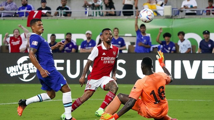 Arsenals Gabriel Jesus, center, scores a goal as he gets between Chelsea goalkeeper Edouard Mendy (16) and Arsenals Thiago Silva, left, during the first half of a Florida Cup friendly soccer match Saturday, July 23, 2022, in Orlando, Fla. (AP Photo/John Raoux)