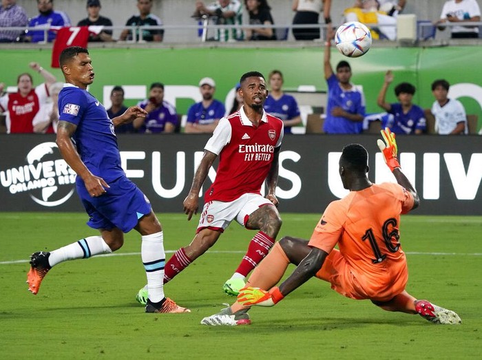 Arsenals Gabriel Jesus, center, scores a goal as he gets between Chelsea goalkeeper Edouard Mendy (16) and Arsenals Thiago Silva, left, during the first half of a Florida Cup friendly soccer match Saturday, July 23, 2022, in Orlando, Fla. (AP Photo/John Raoux)