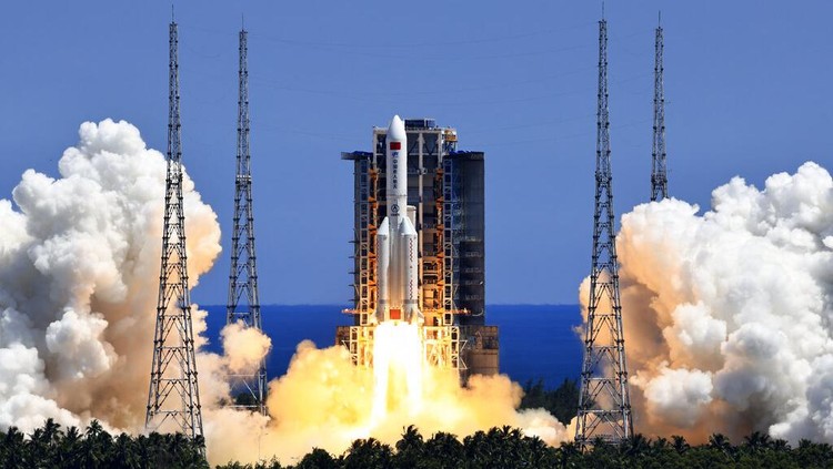 In this photo released by Xinhua News Agency, the Long March 5B Y3 carrier rocket, carrying Wentian lab module blasts off from the Wenchang Space Launch Center in Wenchang in southern Chinas Hainan Province Sunday, July 24, 2022. On a hot Sunday afternoon, with a large crowd of amateur photographers and space enthusiasts watching, China launched the Wentian lab module from tropical Hainan Island. (Li Gang/Xinhua via AP)
