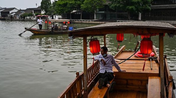 This long exposure photo taken on July 24, 2022 shows the Zhujiajiao ancient water town in Shanghai. (Photo by Hector RETAMAL / AFP) (Photo by HECTOR RETAMAL/AFP via Getty Images)