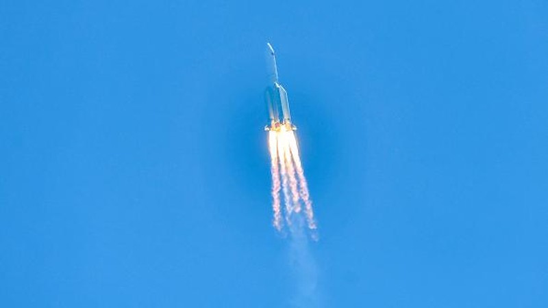 WENCHANG, CHINA - JULY 24: Spectators watch as a Long March-5B Y3 rocket carrying China's space station lab module Wentian blasts off from Wenchang Spacecraft Launch Site on July 24, 2022 in Wenchang, Hainan Province of China. (Photo by Luo Yunfei/China News Service via Getty Images)