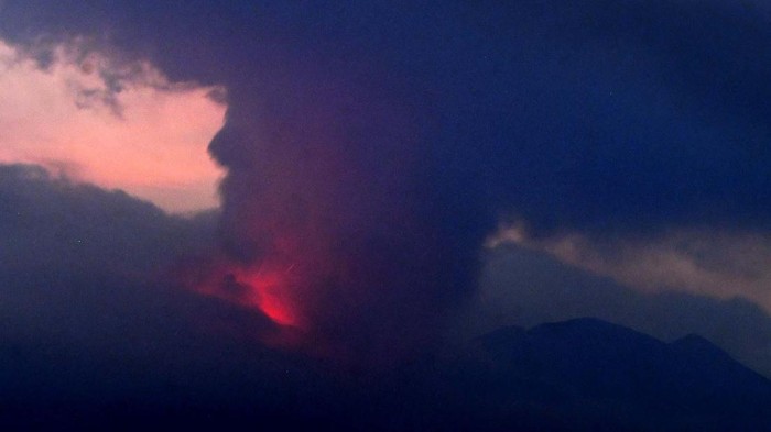 Ash from Sakurajima volcano is seen on a vehicle in Kagoshima, southern island of Kyushu, Japan Monday, July 25, 2022. The volcano erupted Sunday night, spewing ash and rocks, causing dozens of residents in nearby towns to evacuate to a safer part of the region. (Kyodo News via AP)