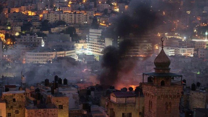 A picture taken after clashes between Israeli troops and Palestinian gunmen in the Old City of Nablus in the occupied West Bank on July 24, 2022 shows a house where the militants were hiding after it was hit by Israeli gunfire. - Two Palestinians were killed and six others wounded overnight during an Israeli army raid on Nablus, according to the Palestinian health ministry. The Israeli army confirmed carrying out an operation in the area in a statement which said there were exchanges of fire between armed suspects and troops. (Photo by JAAFAR ASHTIYEH / AFP) (Photo by JAAFAR ASHTIYEH/AFP via Getty Images)