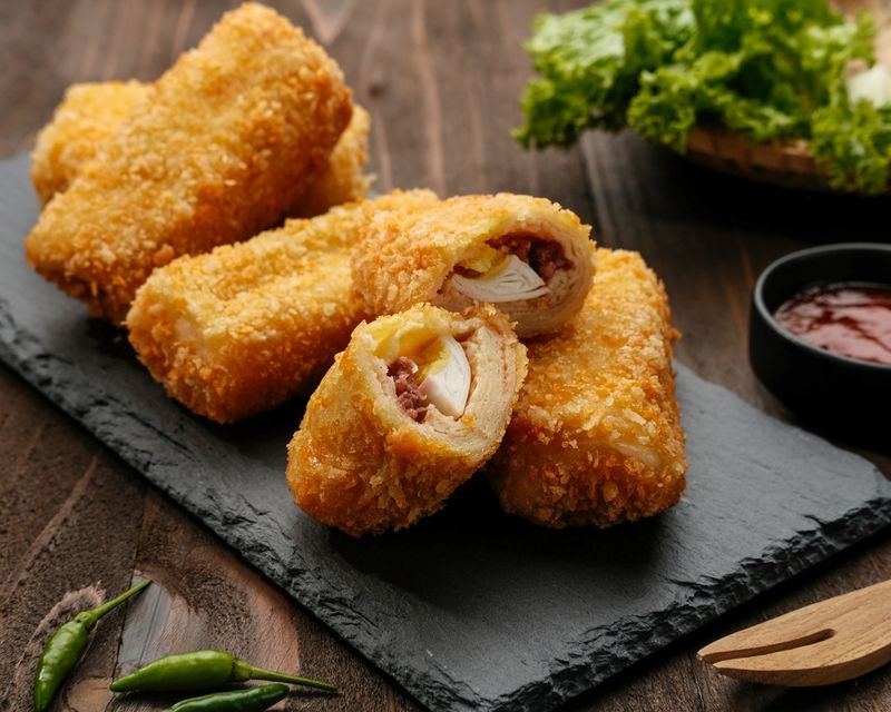 Risoles or Risol is a typical Indonesian traditional street food made from flour skin, meat and egg stuffing inside with mayonnaise and chili sauce.