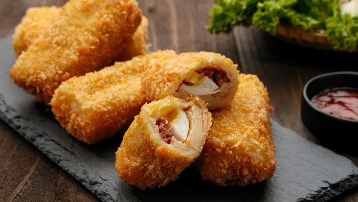 Risoles or Risol is a typical Indonesian traditional street food made from flour skin, meat and egg stuffing inside with mayonnaise and chili sauce.