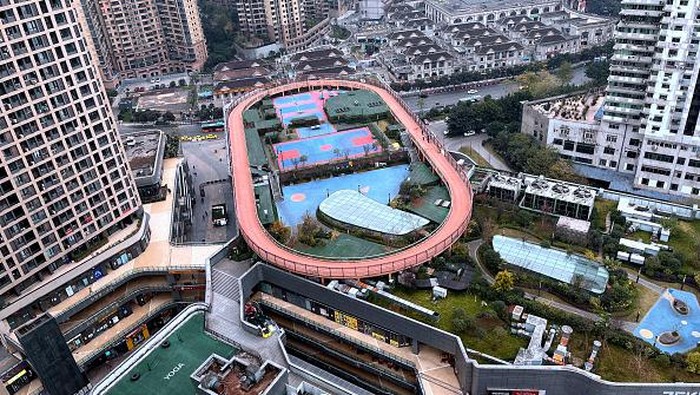 CHONGQING, CHINA - DECEMBER 8, 2021 - A sports stadium is seen on the roof of a shopping mall in Chongqing, China, on December 8, 2021. It is reported that the 