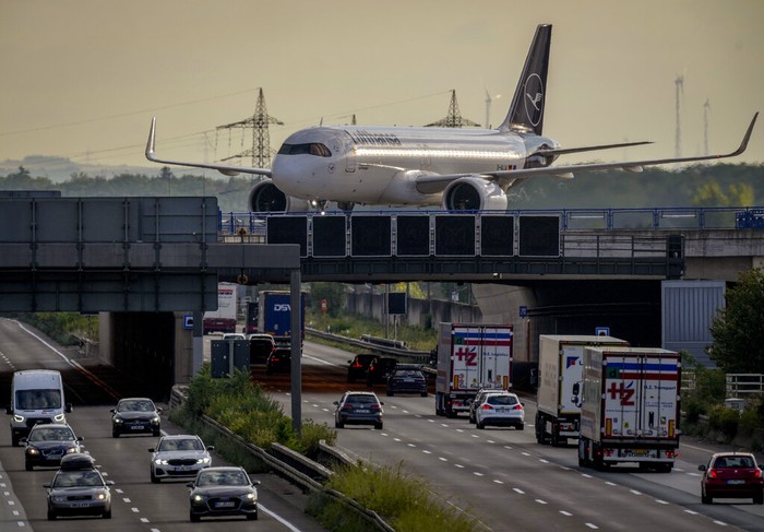 Passengers queue at check in counters at the international airport in Frankfurt, Germany, Wednesday, July 27, 2022. Lufthansa went for a 24-hours-strike on Wednesday, most of the Lufthansa flights had to be cancelled. (AP Photo/Michael Probst)