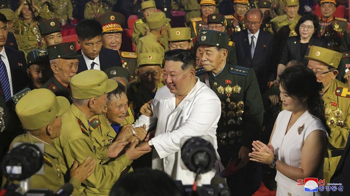 In this photo provided by the North Korean government, North Korean leader Kim Jong Un, third right, shakes hands with war veterans during a ceremony to mark the 69th anniversary of the signing of the ceasefire armistice that ends the fighting in the Korean War, in Pyongyang, North Korea Wednesday, July 27, 2022. Independent journalists were not given access to cover the event depicted in this image distributed by the North Korean government. The content of this image is as provided and cannot be independently verified. Korean language watermark on image as provided by source reads: 