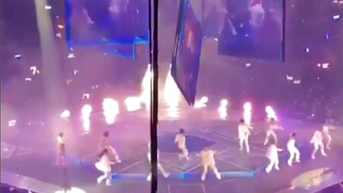 CORRECTS DATE - In this image made from video taken from social media, a massive video screen suspended above the stage fells onto performers at a concert of Cantopop boy band Mirror, in Hong Kong, Thursday, July 28, 2022. Two dancers were injured at a Cantopop concert in Hong Kong after a massive video screen suspended above the stage fell onto performers below. (AP Photo)