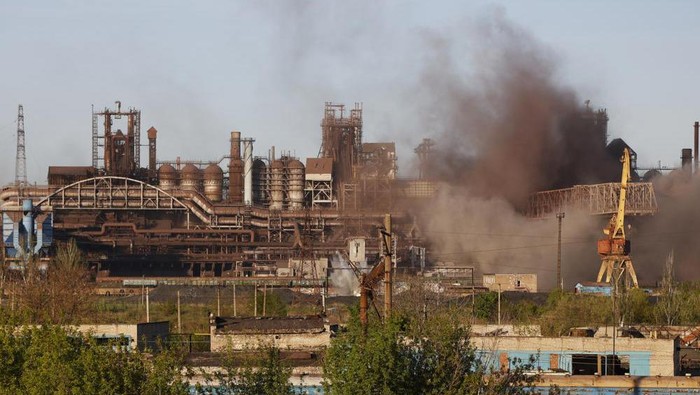 FILE - Smoke rises from the Metallurgical Combine Azovstal in Mariupol during shelling, in Mariupol, in territory under the government of the Donetsk Peoples Republic, eastern Ukraine, Saturday, May 7, 2022. Russia-backed separatists in eastern Ukraine say that at least 40 Ukrainian prisoners of war captured during the fighting for Mariupol have been killed by Ukrainian shelling. (AP Photo/Alexei Alexandrov, File)