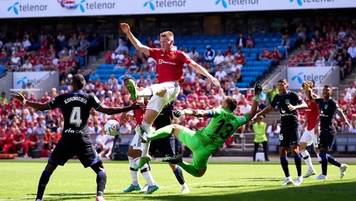 OSLO, NORWAY - JULY 30: Scott McTominay of Manchester United clashes with Jan Oblak of Atletico de Madrid during the pre-season friendly match between Manchester United and Atletico Madrid at Ullevaal Stadion on July 30, 2022 in Oslo, Norway. (Photo by Manchester United/Manchester United via Getty Images)