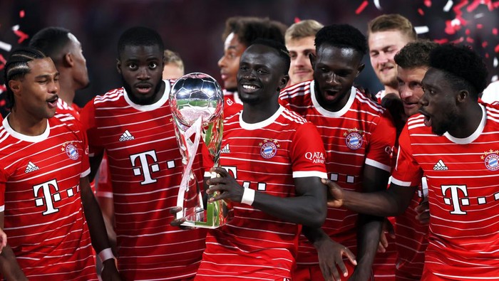 LEIPZIG, GERMANY - JULY 30: Sadio Mane of Bayern Munich celebrates with the Supercup trophy after the final whistle of the Supercup 2022 match between RB Leipzig and FC Bayern München at Red Bull Arena on July 30, 2022 in Leipzig, Germany. (Photo by Martin Rose/Getty Images)