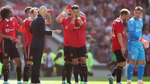 MANCHESTER, ENGLAND - JULY 31: Manchester United manager Erik ten Hag chats with Christiano Ronaldo of Manchester United during the Pre-Season Friendly match between Manchester United and Rayo Vallecano at Old Trafford on July 31, 2022 in Manchester, England. (Photo by Jan Kruger/Getty Images)