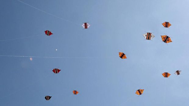People fly their kites during the Kite Festival at Mertasari beach in Sanur on the Indonesian resort island of Bali on July 31, 2022. (Photo by SONNY TUMBELAKA / AFP) (Photo by SONNY TUMBELAKA/AFP via Getty Images)