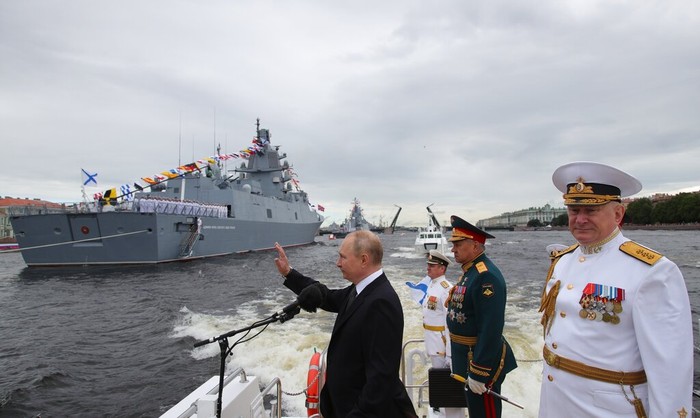 Russian President Vladimir Putin, center, Russian Defense Minister Sergei Shoigu, second right, and Commander-in-Chief of the Russian Navy Admiral Nikolai Yevmenov review warships before the main naval parade marking Russian Navy Day in the Gulf of Finland, St. Petersburg, Russia, Sunday, July 31, 2022. (Mikhail Klimentyev, Sputnik, Kremlin Pool Photo via AP)