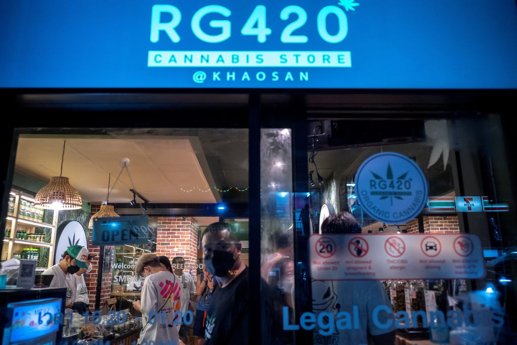 Tourists shop cannabis at the RG420 cannabis store, at Khaosan Road, one of the favourite tourist spots in Bangkok, Thailand, July 31, 2022. REUTERS/Athit Perawongmetha
