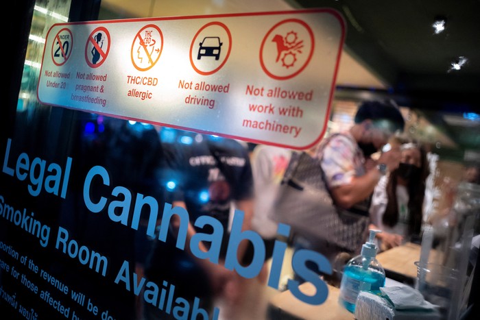 Tourists shop cannabis at the RG420 cannabis store, at Khaosan Road, one of the favourite tourist spots in Bangkok, Thailand, July 31, 2022. REUTERS/Athit Perawongmetha