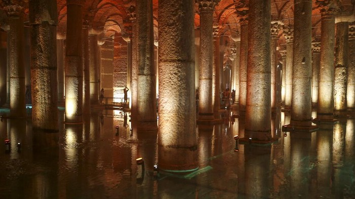 A hand shape sculpture is reflected in the water at the Byzantine-era Basilica Cistern in Istanbul, Turkey, Wednesday, July 27, 2022. The historical cistern, which is the biggest in Istanbul, was built in the 6th century during the reign of Byzantine Emperor Justinian I. (AP Photo/Emrah Gurel)