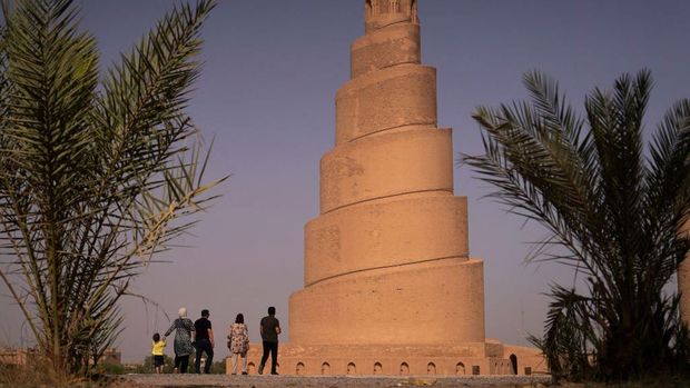 An aerial view shows the spiral Malwiya minaret, a mid-ninth century treasured Iraqi national monument, at the site of the Great Mosque of Samarra, on July 26, 2022, in the city of Samarra, north of Baghdad. - The 50m helicoidally tower of sun-dried and baked brick, modelled on ancient ziggurats that was built to symbolise the power of Islam during the Abbasid caliphate, was listed UNESCO World Heritage Site in 2007. (Photo by Ismael ADNAN / AFP) (Photo by ISMAEL ADNAN/AFP via Getty Images)