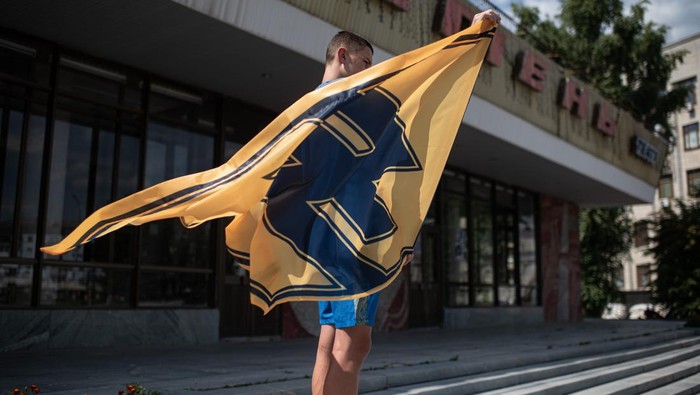 1242248204 ZHYTOMYR, UKRAINE - AUGUST 01: People shout slogans and hold banners during a rally in support of Azov Battalion Members on August 1, 2022 in Zhytomyr, Ukraine. Last Thursday, a facility holding Ukrainian PoWs in the town of Olenivka, in Russian-occupied Donetsk, was bombed, killing at least 50 people. The prisoners held there included members of the Azov battalion, who were captured at the Azovstal steel plant in Mariupol, however many family members say they can't confirm if their loved ones survived the bombing. Both Russia and Ukraine have blamed each other for the attack and the Red Cross have so far been denied access to the site. (Photo by Alexey Furman/Getty Images)