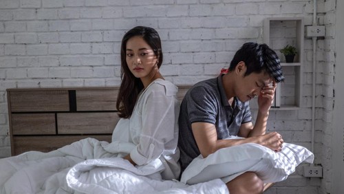 Lovers, they have problems with quarrel. They are in bed. they dont talk.Bored of life after marriage