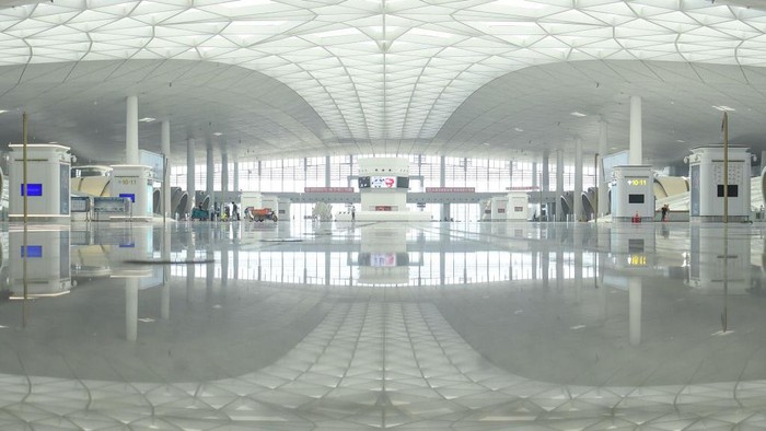 HANGZHOU, CHINA - AUGUST 01: Aerial view of photovoltaic modules on the roof of Hangzhou West Railway Station on August 1, 2022 in Hangzhou, Zhejiang Province of China. As a major traffic hub for the Asian Games Hangzhou 2022, the station has set up 7,540 PV panels for a 15,000-square-meter area, which is expected to generate 2.31 million kilowatt-hours of electricity annually, and reduce carbon dioxide emissions by more than 2,330 tons every year. (Photo by Wang Gang/China News Service via Getty Images)