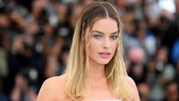 Margot Robbie dikisahkan bercinta dengan Leonardo DiCaprio di atas tumpukan uang kertas. Foto: Corbis via Getty Images/Stephane Cardinale - Corbis