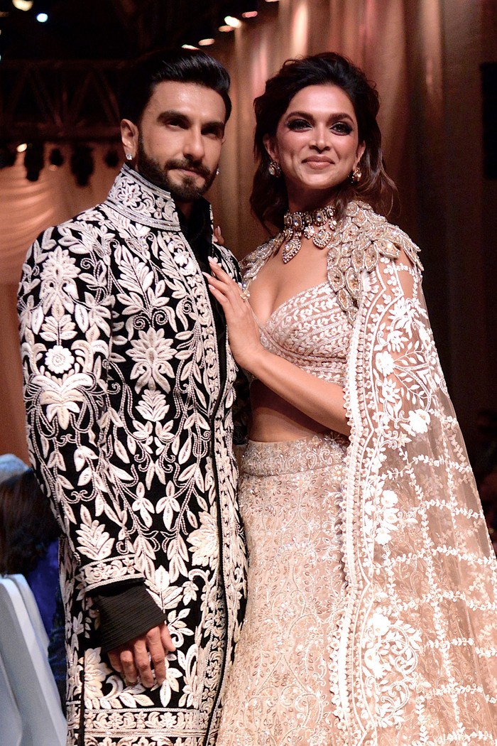Deepika Padukone In this picture taken on July 29, 2022, Bollywood actors Ranveer Singh and Deepika Padukone walk the ramp for Mijwan Welfare Society and fashion show by designer Manish Malhotra in Mumbai. (Photo by SUJIT JAISWAL / AFP) (Photo by SUJIT JAISWAL/AFP via Getty Images)