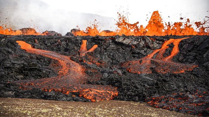 A close-up of the lava flowing from Fagradalsfjall volcano in Iceland on Wednesday Aug. 3, 2022, which is located 32 kilometers (20 miles) southwest of the capital of Reykjavik and close to the international Keflavik Airport. Authorities in Iceland say the volcano in the southwest of the country is erupting just eight months after its last eruption officially ended. (AP Photo/Marco Di Marco)
