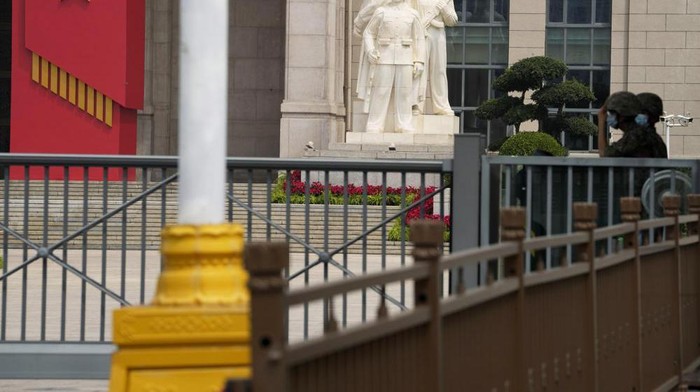 FILE - Chinese soldiers wearing masks guard the entrance to the military museum in Beijing on Aug. 1, 2022. China says military exercises by its navy, air force and other departments are underway in six zones surrounding Taiwan. The drills were prompted by a visit to the island Tuesday, Aug. 2, by Speaker of the U.S. House of Representatives Nancy Pelosi and are intended to advertise China’s threat to attack the self-governing island republic in response to moves to solidify its de facto independence from Chinese rule with support from key ally the U.S. (AP Photo/Ng Han Guan, File)
