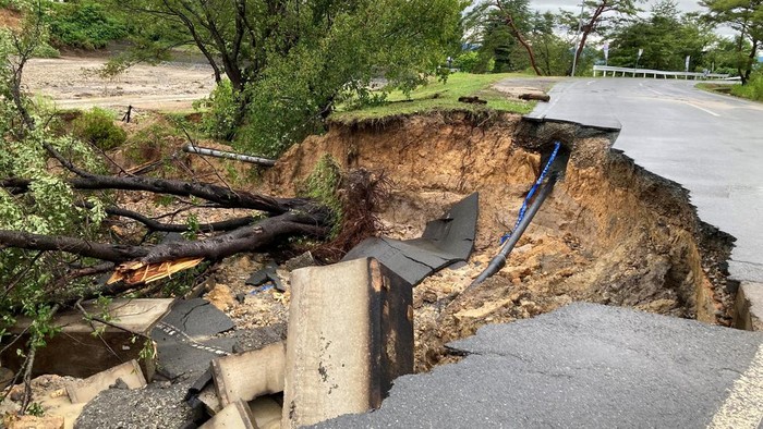 A view of a road damaged by rain in Kawanishi-machi, Yamagata Prefecture, Japan August 4, 2022, in this picture obtained from social media. @ximaverse/via REUTERS  THIS IMAGE HAS BEEN SUPPLIED BY A THIRD PARTY. MANDATORY CREDIT. NO RESALES. NO ARCHIVES.