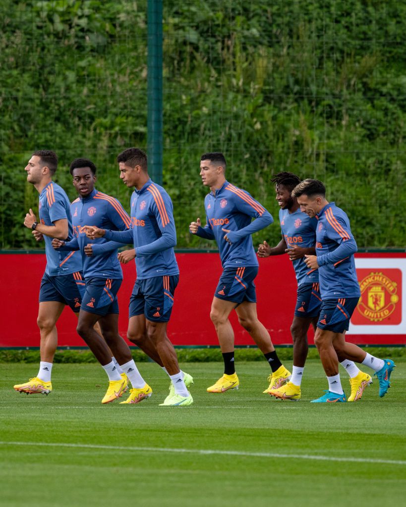 MANCHESTER, ENGLAND - AUGUST 03: (EXCLUSIVE COVERAGE)  Anthony Elanga, Bruno Fernandes, Cristiano Ronaldo of Manchester United in action during a first team training session at Carrington Training Ground on August 03, 2022 in Manchester, England. (Photo by Ash Donelon/Manchester United via Getty Images)