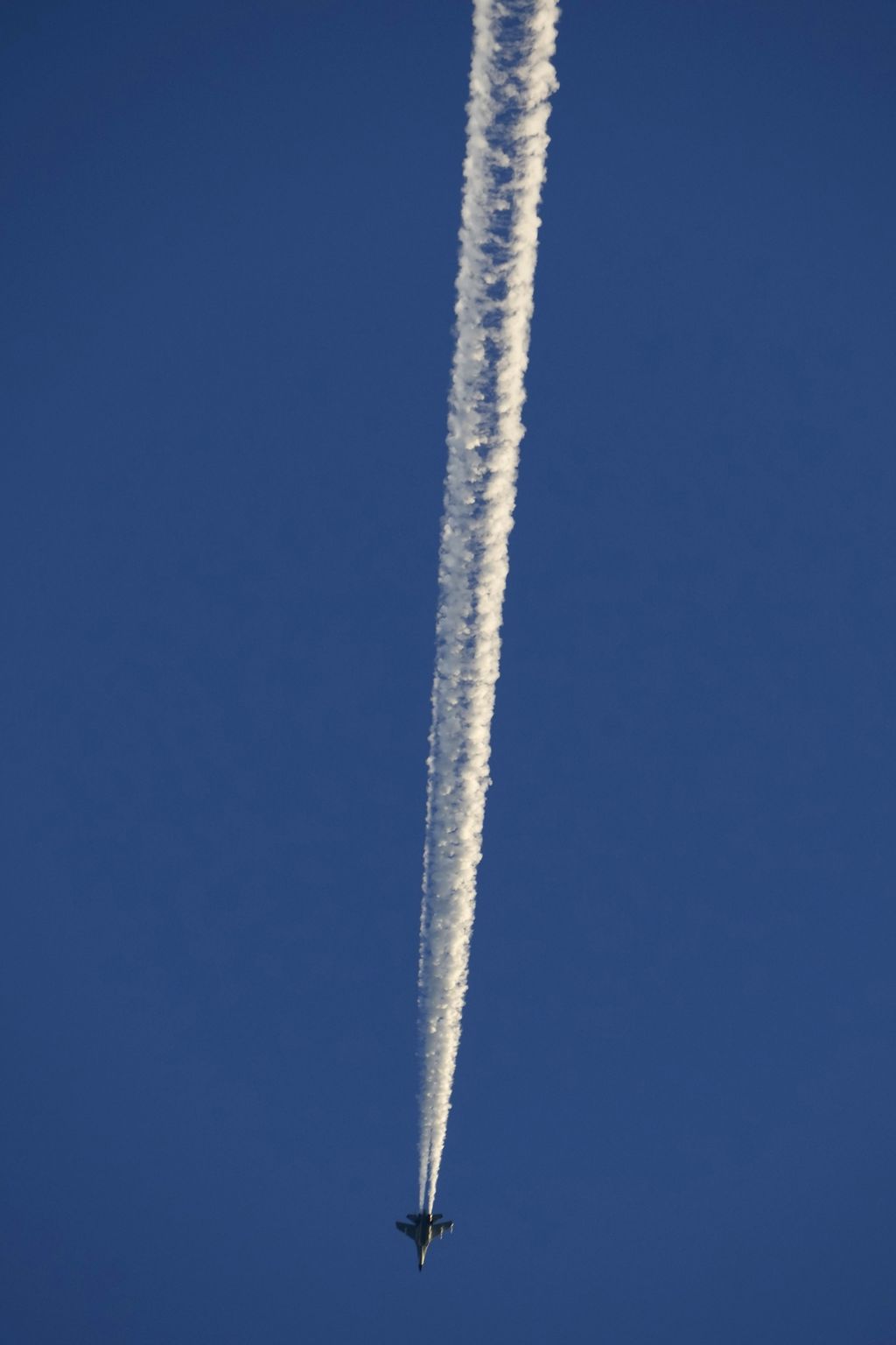 A military jet fighter flies above the Taiwan Strait as seen from the 68-nautical-mile scenic spot, the closest point in mainland China to the island of Taiwan, in Pingtan in southeastern China's Fujian Province, Friday, Aug. 5, 2022. China says it is canceling or suspending dialogue with the U.S. on issues from climate change to military relations and anti-drug efforts in retaliation for a visit this week to Taiwan by U.S. House Speaker Nancy Pelosi. (AP Photo/Ng Han Guan)