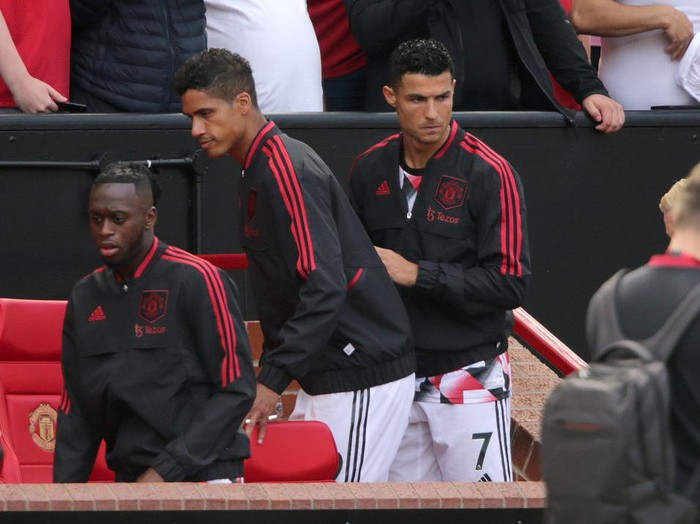 Manchester United's Cristiano Ronaldo (right) takes his seat on the bench before the Premier League match at Old Trafford, Manchester. Picture date: Sunday August 7, 2022. (Photo by Ian Hodgson/PA Images via Getty Images)