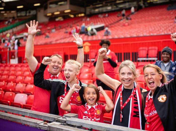 MANCHESTER, ENGLAND - AUGUST 07: Manchester United fans arrive ahead of the Premier League match between Manchester United and Brighton & Hove Albion at Old Trafford on August 07, 2022 in Manchester, England. (Photo by Ash Donelon/Manchester United via Getty Images)