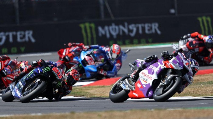 Ducati Pramac Racing's French rider Johann Zarco (R) leads Monster Energy Yamaha's French rider Fabio Quartararo (C) during the MotoGP race of the British Grand Prix at Silverstone circuit in Northamptonshire, central England, on August 7, 2022. (Photo by ADRIAN DENNIS / AFP) (Photo by ADRIAN DENNIS/AFP via Getty Images)