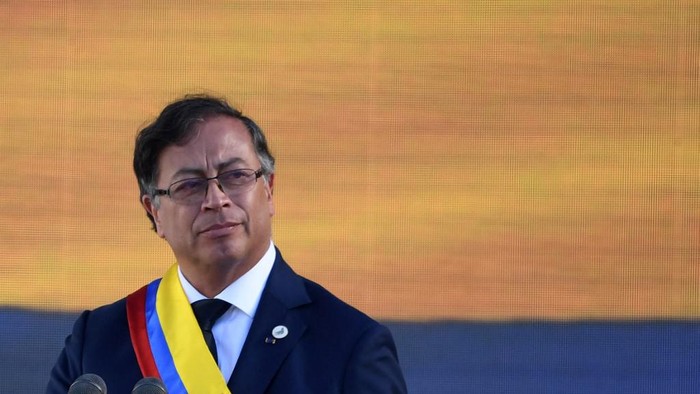 Colombias new President Gustavo Petro gestures during the inauguration ceremony at the Bolivar square in Bogota, on August 7, 2022. - Ex-guerrilla and former mayor Gustavo Petro was sworn in as Colombias first-ever leftist president, with plans for profound reforms in a country beset by economic inequality and drug violence. (Photo by JUAN BARRETO / AFP)