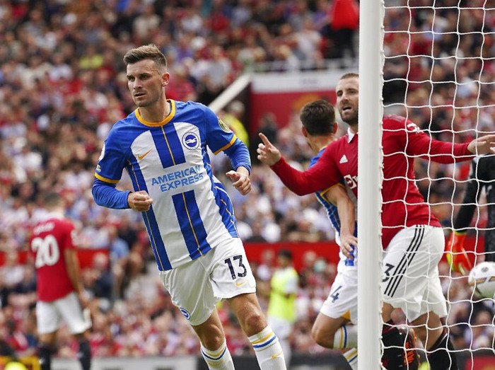 Brighton's Pascal Gross celebrates after scoring his side's opening goal during the English Premier League soccer match between Manchester United and Brighton at Old Trafford stadium in Manchester, England, Sunday, Aug. 7, 2022. (AP Photo/Dave Thompson)