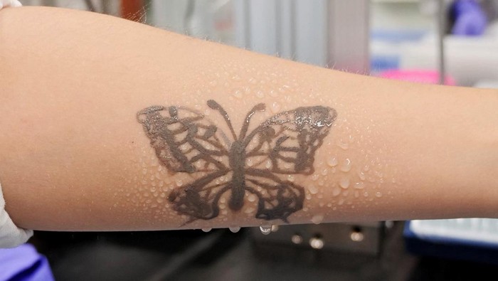 Steve Park, Materials Science & Engineering professor at Korea Advanced Institute of Science and Technology (KAIST), demonstrates an electronic tattoo (e-tattoo) on his arm connected with an electrocardiogram (ECG) monitoring system in Daejeon, South Korea, July 26, 2022.   REUTERS/Minwoo Park