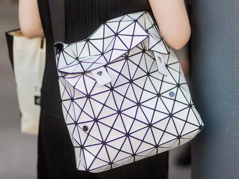 PARIS, FRANCE - JUNE 22: A guest wearing a Issey Miyake bag outside Issey Miyake during Paris Fashion Week - Menswear Spring/Summer 2018 on June 22, 2017 in Paris, France. (Photo by Christian Vierig/Getty Images)