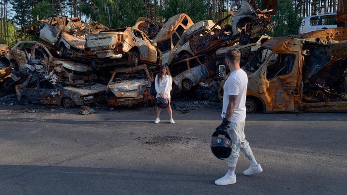 IRPIN, UKRAINE - APRIL 20: Cars shot up and burnt during the month-long Russian military presence are piled alongside the road in the suburb northwest of Kyiv of Irpin, Ukraine, on April 20, 2022. Russian forces that invaded Ukraine on three fronts in late February were defeated in their efforts to cut-off and encircle the capital Kyiv, forcing a withdrawal which left behind hundreds of dead Ukrainian civilians on the streets and in yards, and in hastily dug temporary graves, making Bucha, Irpin and other suburbs now symbols of Russian military cruelties and reason for war crimes accusations. (Photo by Scott Peterson/Getty Images)