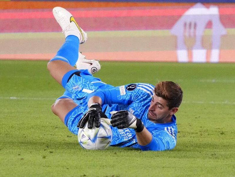 Real Madrid's goalkeeper Thibaut Courtois makes a save during the UEFA Super Cup final soccer match between Real Madrid and Eintracht Frankfurt at Helsinki's Olympic Stadium, Finland, Wednesday, Aug. 10, 2022. (AP Photo/Sergei Grits)