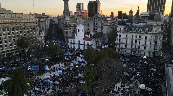 Demonstrators gather in the Plaza de Mayo in a protest demanding more money for social programs that support unemployed people in downtown Buenos Aires, Argentina, Wednesday, Aug. 10, 2022. (AP Photo/Natacha Pisarenko)