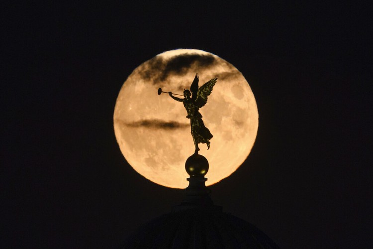 China Supermoon A Supermoon rises in the night sky in Beijing, Thursday, Aug. 11, 2022. (AP Photo/Ng Han Guan)